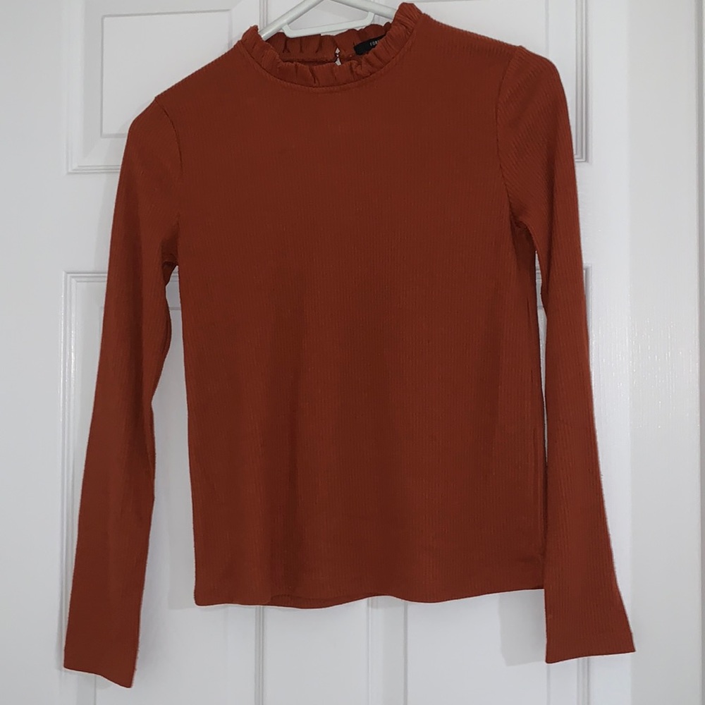 Ruffled mock orange turtle neck